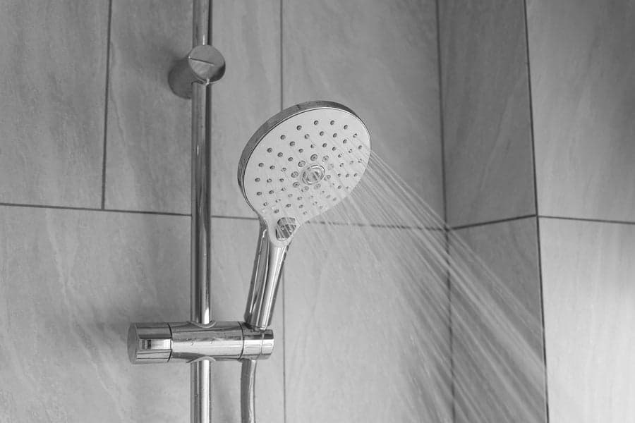 Shiny limescale-free bathroom taps and tiles